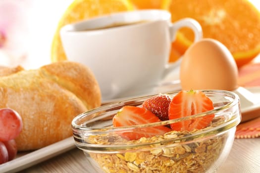 Breakfast with coffee, rolls, egg, orange juice, muesli and cheese