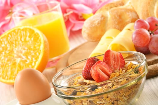 Breakfast with coffee, rolls, egg, orange juice, muesli and cheese