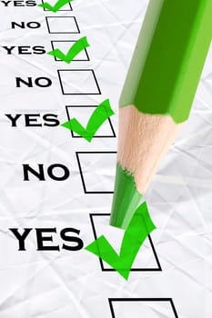 marked check boxes "yes"" and big green pencil"