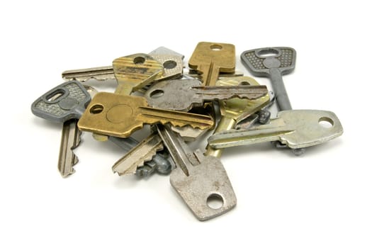 many old keys over a white background