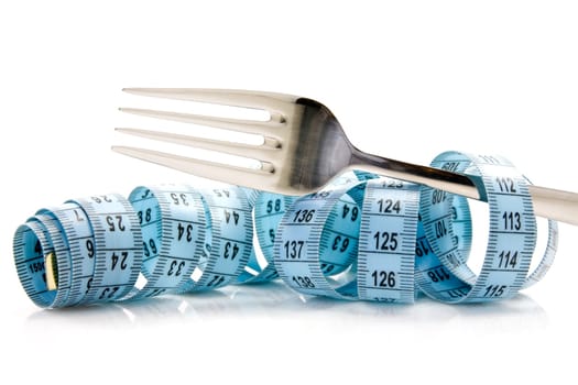 blue measure tape and fork on white background