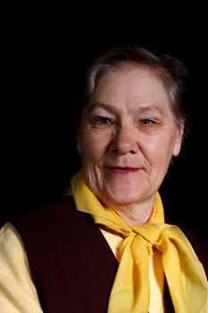 smiling old woman portrait on a black background