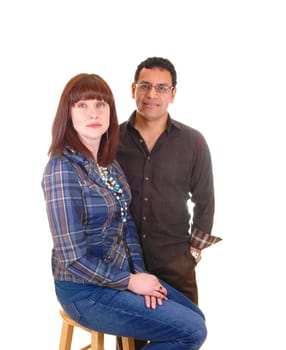The portrait of a couple, Hispanic and Caucasian in there forties. She with red hair and he in brown clothing, for white background.