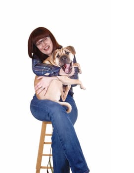 A lovely woman with red hair holding her sharpei dog on her lap, but the dog fight to go down, for white background.