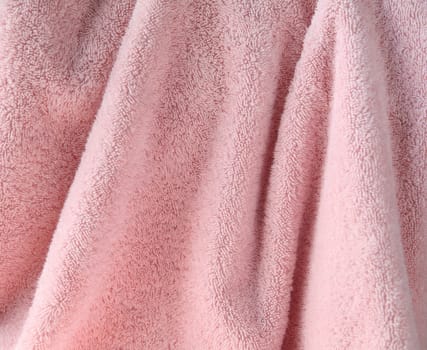 a large pale pink bath towel close up