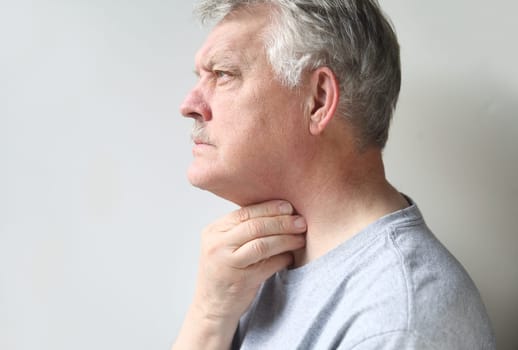 a senior is suffering from a sore throat