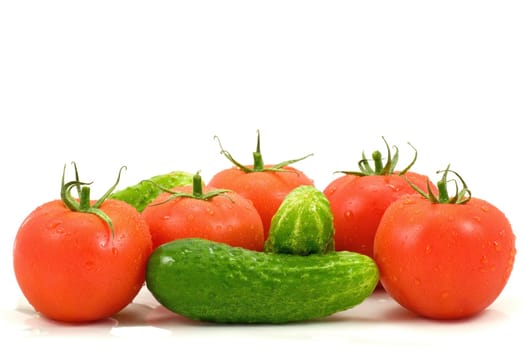 fresh tomatoes and cucumbers isolated on white background