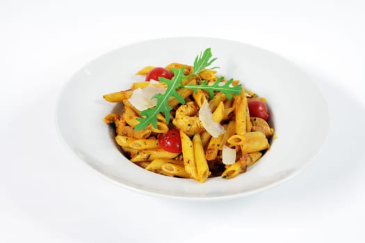 Penne alla vodka with chicken meat and salad rucola