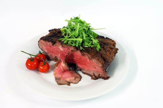 Roastbeef with gherkin and hot pepper on white background