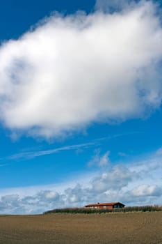 Cloud over house and field