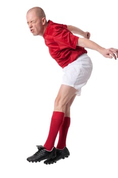 Studio shot of a footballer against a white background