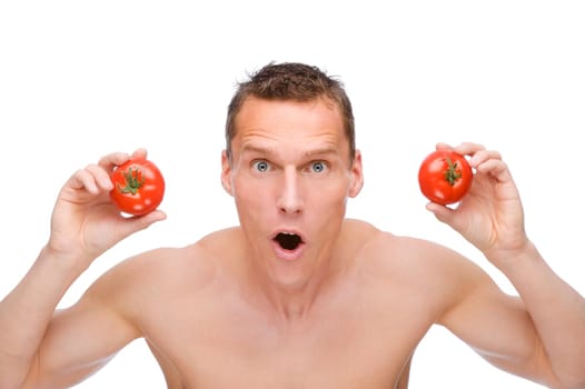 Studio shot of a young man with tomatoes