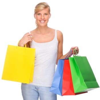 Studio shot of a young woman with shopping bags