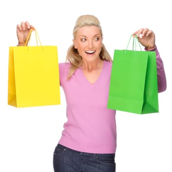 Studio shot of a young woman with shopping bags