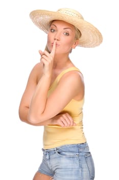 Studio shot of a young woman in a straw hat