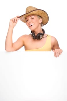 Studio shot of a young woman wearing a straw hat and billboard