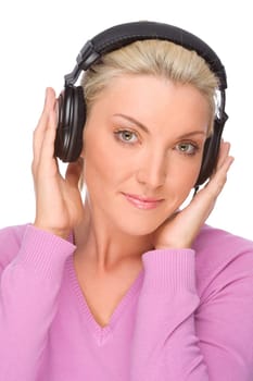 Studio shot of a young woman wearing headphones