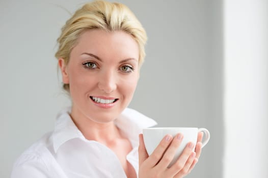 Young woman with a cup of coffee