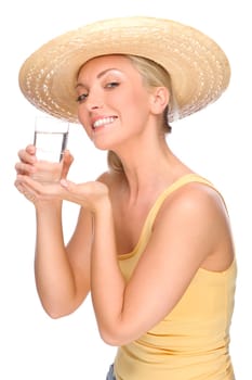 Studio shot of a young woman with a straw hat and a glass of water