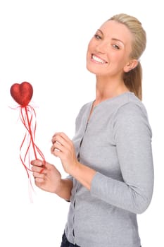 Studio shot of a young woman with a red heart