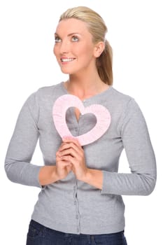 Studio shot of a young woman with a heart