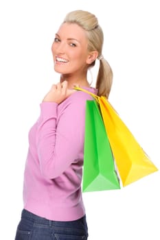 Studio shot of a young woman with shopping bags