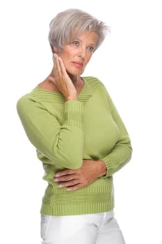 Studio shot of a thoughtful senior woman