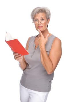 Studio shot of an active senior woman with a book