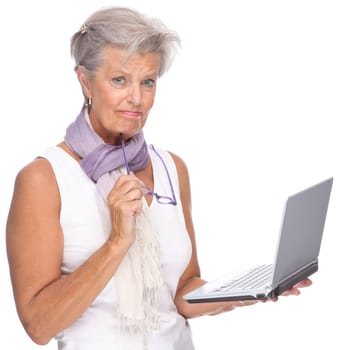 Studio shot of an active senior woman using a notebook