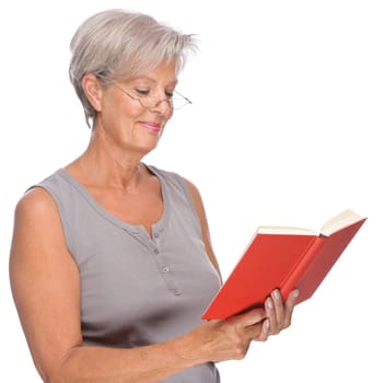 Studio shot of an active senior woman with a book