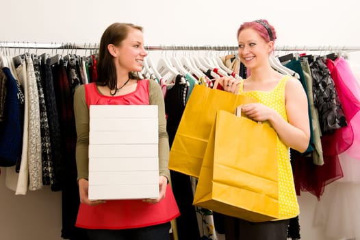 Two young women with shopping bags