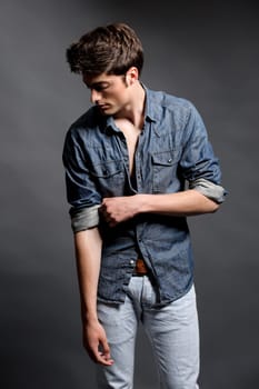 Fashion shot of a young man in the studio