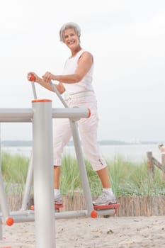 Active senior woman on the beach