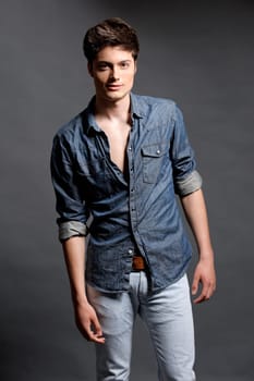 Fashion shot of a young man in the studio
