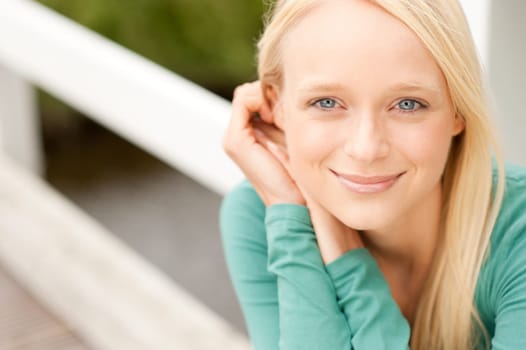 Portrait of a young and smiling woman in the park