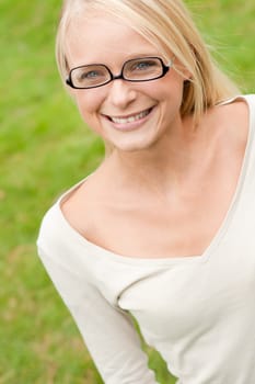 Portrait of a young and smiling woman in the park