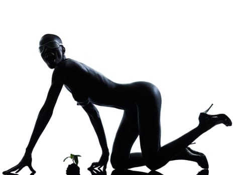 one beautiful black african naked woman protecting nature in studio isolated on white background