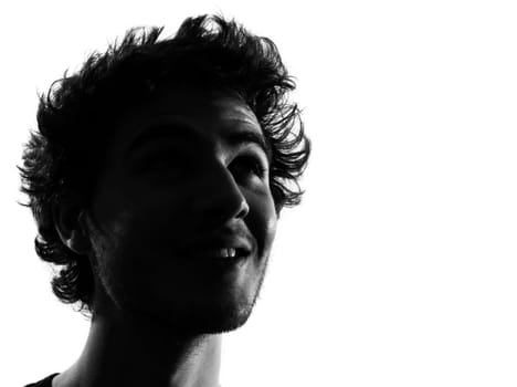 young man looking up portrait silhouette in studio isolated on white background