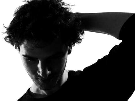 young man sad silhouette in studio isolated on white background