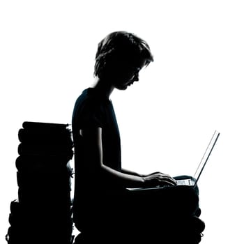 one caucasian young teenager silhouette boy or girl studying with computer computing laptop in studio cut out isolated on white background