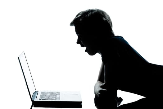 one caucasian young teenager silhouette boy or girl studying with computer computing laptop in studio cut out isolated on white background