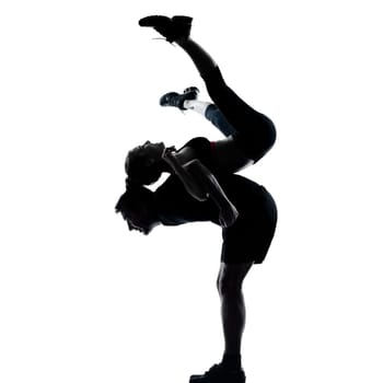 couple woman man exercising workout fitness aerobics posture in silhouette studio isolated on white background