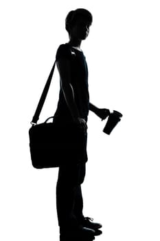 one caucasian young teenager silhouette boy or girl portrait holding empty vodka alcohol bottle in studio cut out isolated on white background