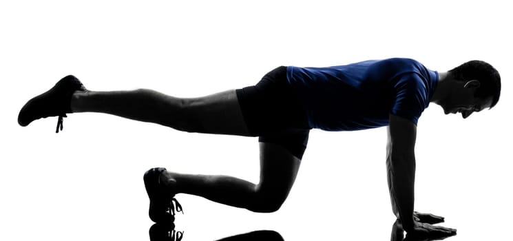 man exercising workout fitness aerobics posture in silhouette studio isolated on white background