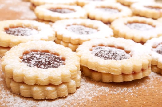 Closeup of Traditional Linzer Cookies on Wooden Board