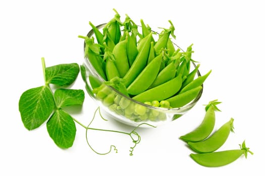 fresh sugar snap peas decoratively arranged in a glass bowl