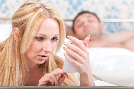 couple problem - woman reading a message on the phone from her lover