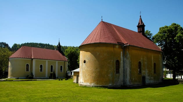 old chapels in Svidnik, Slovakia  clear blue sky, green grass