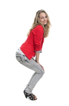 Full portrait of a young woman wearing jeans and red jacket