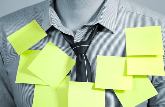 Businessman with plenty of post it notes